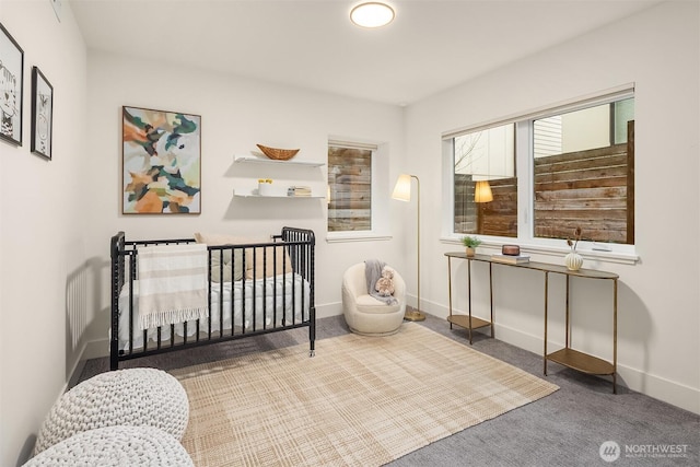 carpeted bedroom with baseboards