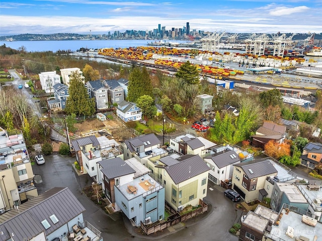 birds eye view of property featuring a view of city and a water view