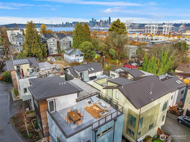 birds eye view of property with a residential view