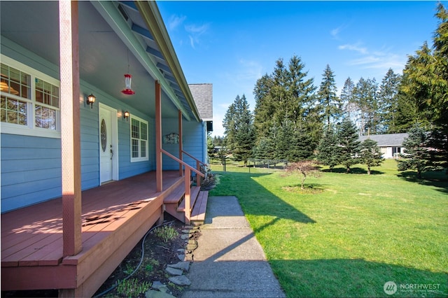 view of yard with covered porch