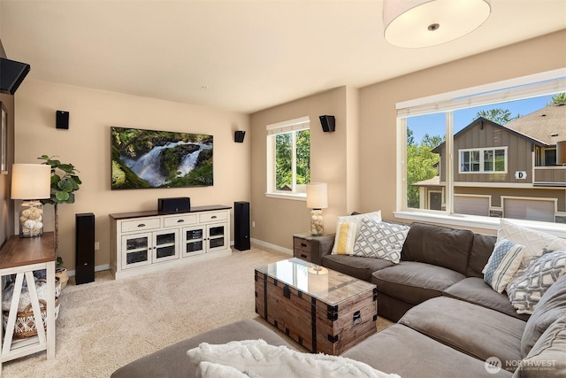 living room featuring carpet floors and baseboards