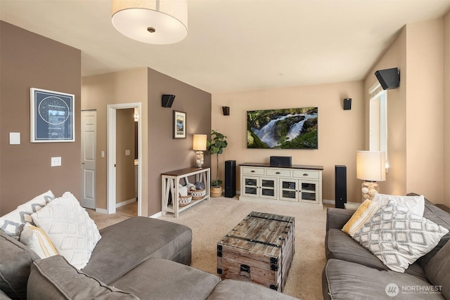 living room with carpet floors and baseboards