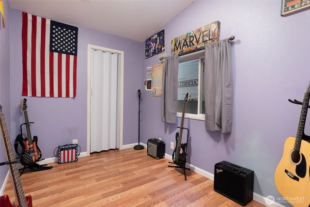 miscellaneous room featuring light wood-style flooring and baseboards