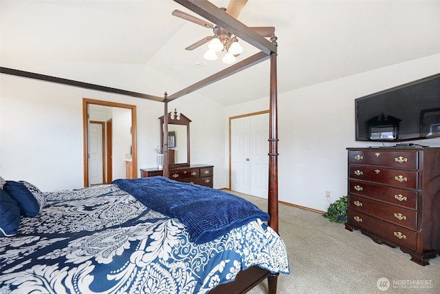 bedroom featuring a closet, light carpet, vaulted ceiling, ceiling fan, and baseboards