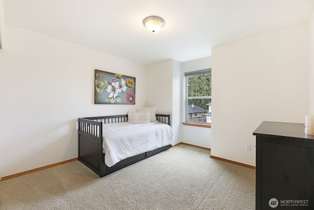 bedroom with carpet flooring and baseboards