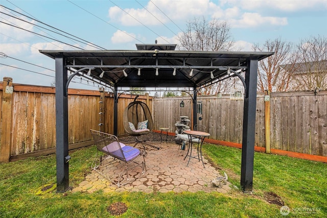 view of patio / terrace with a fenced backyard and a gazebo