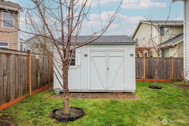 view of shed featuring a fenced backyard