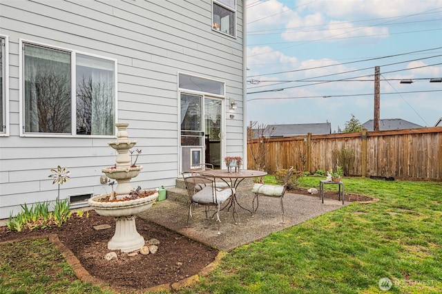 view of patio / terrace featuring fence