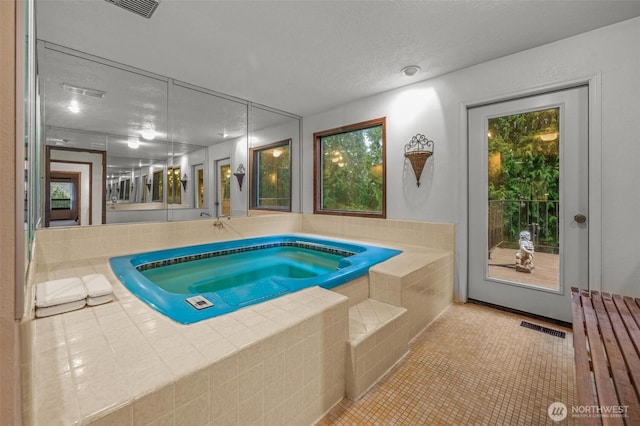 view of swimming pool featuring an indoor in ground hot tub