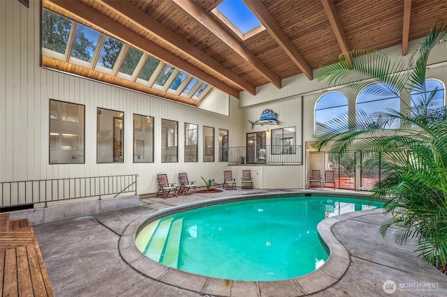 view of swimming pool with a skylight