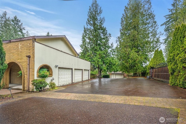 view of property exterior with a garage