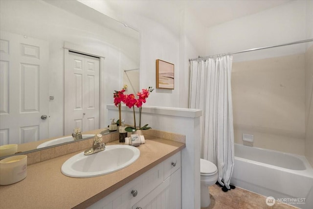 bathroom featuring shower / bath combo, vanity, and toilet