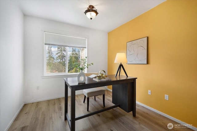 office with baseboards and wood finished floors