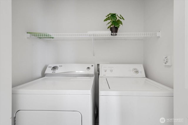 laundry area with laundry area and independent washer and dryer