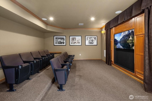 home theater featuring recessed lighting, carpet floors, visible vents, baseboards, and ornamental molding