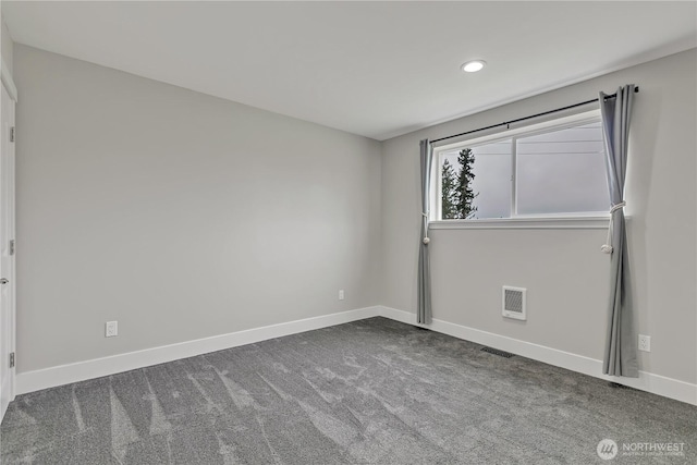 carpeted empty room with visible vents, baseboards, and recessed lighting