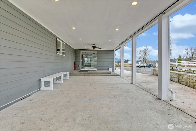 view of patio featuring ceiling fan