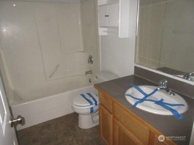 full bath featuring toilet,  shower combination, and vanity