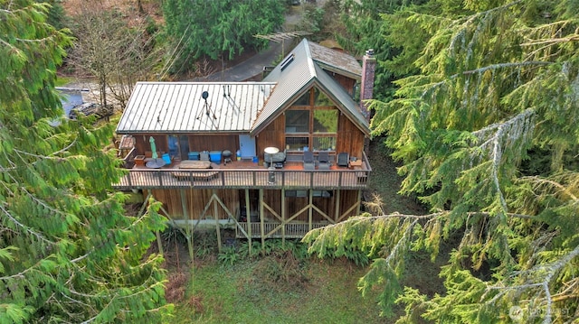 14120 139th Ave SE, Snohomish, WA 98290 - rear view of house with a standing seam roof, metal roof, a chimney, and a wooden deck