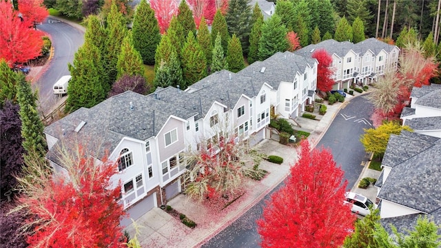 birds eye view of property with a residential view