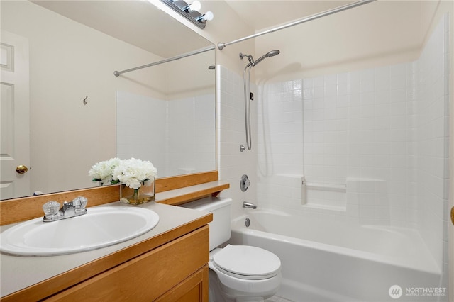 bathroom with shower / bath combination, vanity, and toilet