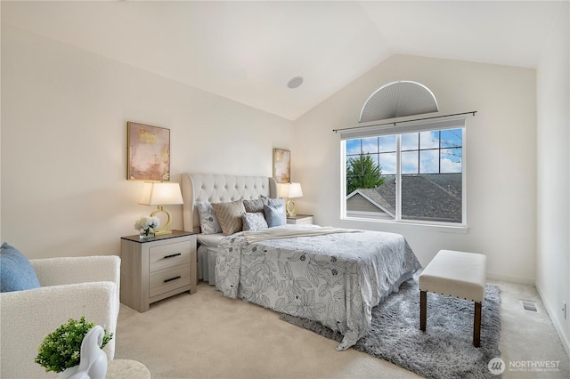 bedroom with light carpet, visible vents, and lofted ceiling