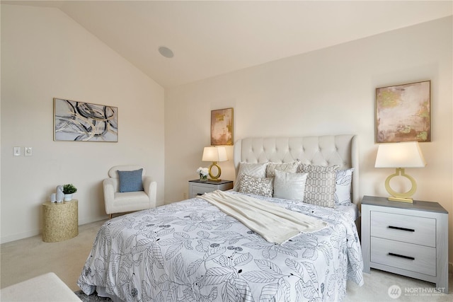 bedroom featuring vaulted ceiling and carpet floors