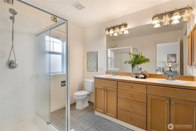 bathroom featuring double vanity, a sink, visible vents, and a shower stall