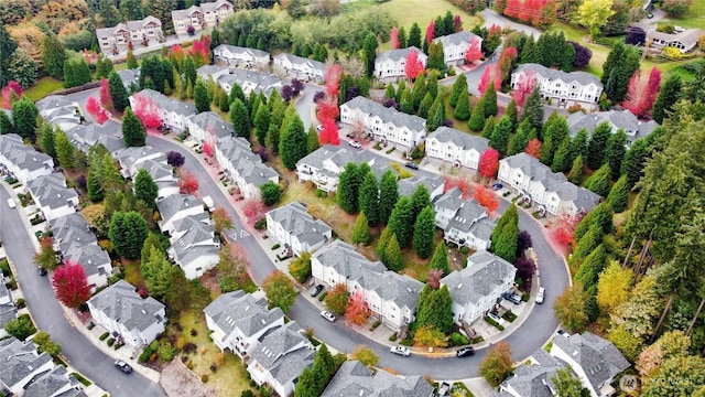 birds eye view of property with a residential view