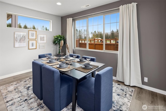 dining space featuring recessed lighting, visible vents, baseboards, and wood finished floors