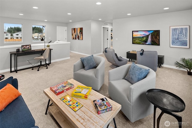 living room featuring recessed lighting, light colored carpet, and baseboards