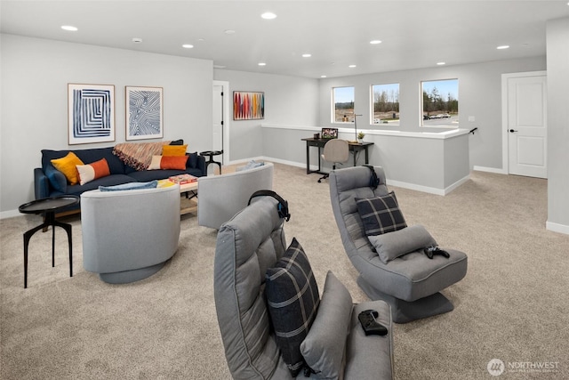 living area featuring light carpet, baseboards, and recessed lighting