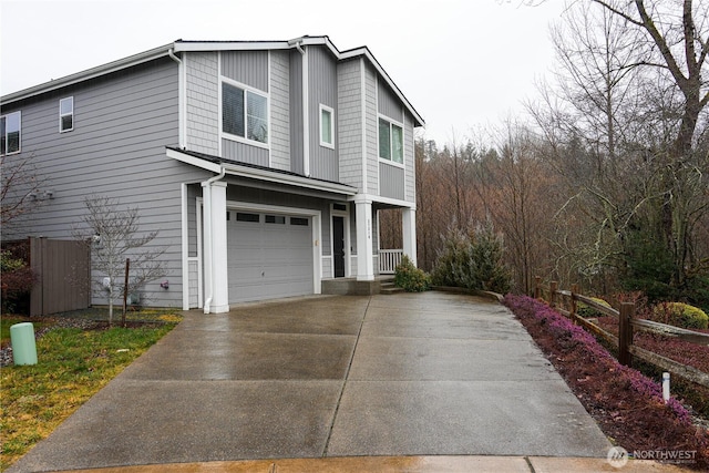 view of front of home with a garage and driveway