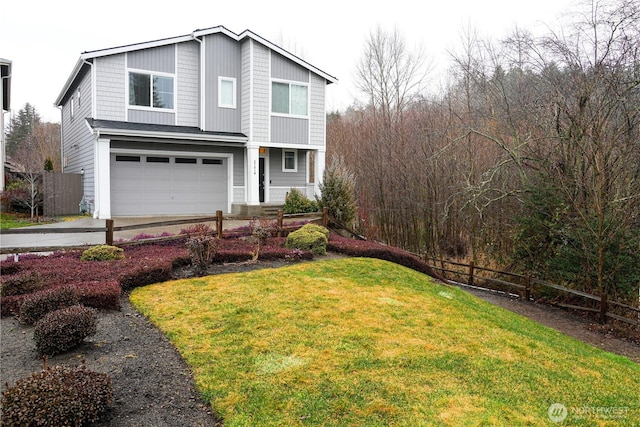 view of front of home featuring a garage, driveway, fence, and a front lawn