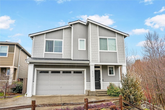 view of front of home featuring an attached garage, concrete driveway, and fence