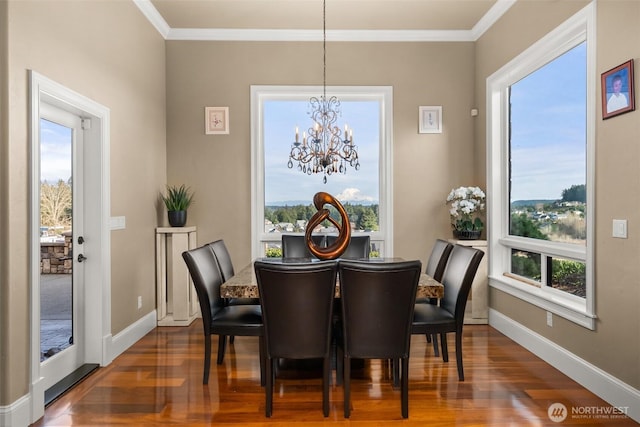 dining area with plenty of natural light, baseboards, and wood finished floors