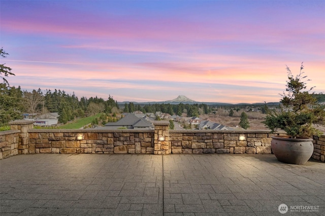 patio terrace at dusk with a mountain view