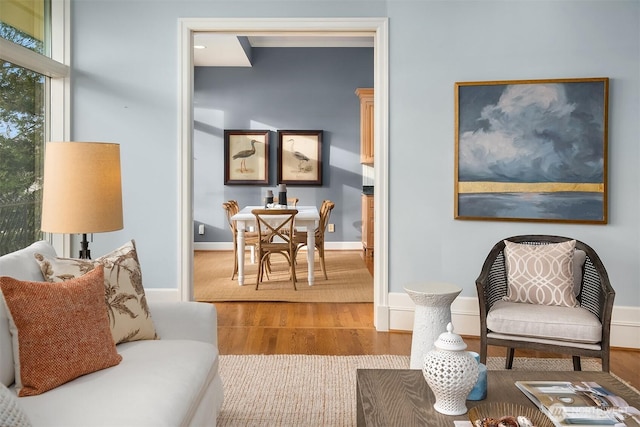 sitting room with wood finished floors and baseboards