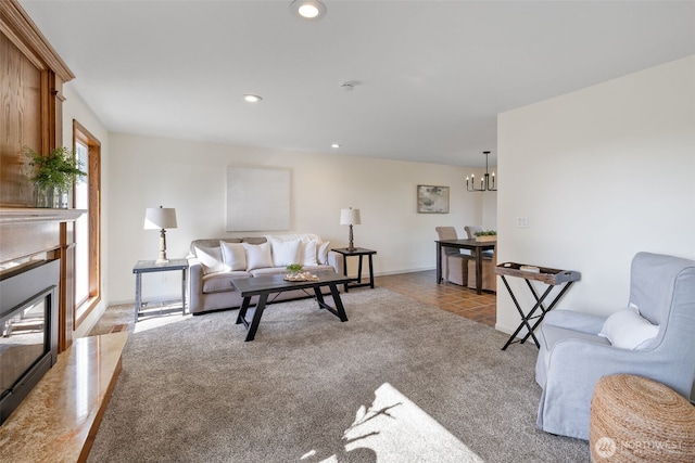 living room featuring light tile patterned floors, recessed lighting, light colored carpet, a fireplace with flush hearth, and an inviting chandelier