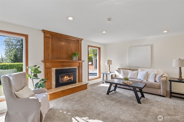 living area with light carpet, a fireplace, and recessed lighting