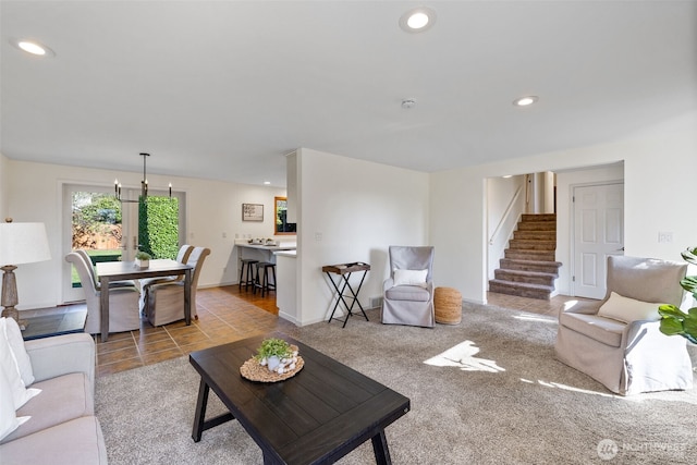 carpeted living area with stairs, recessed lighting, and tile patterned floors