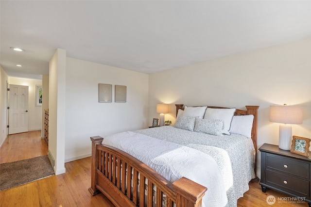 bedroom featuring recessed lighting, light wood-type flooring, and baseboards