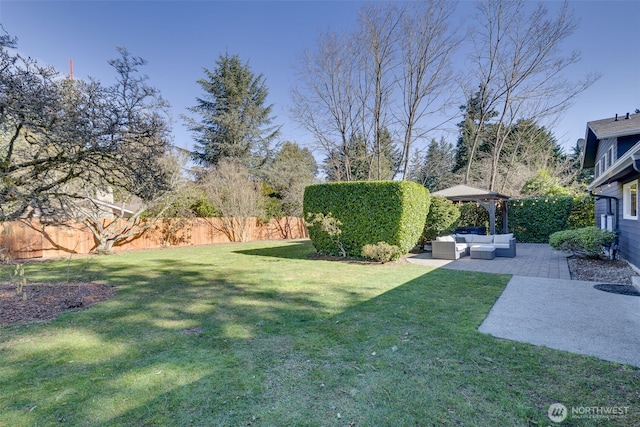 view of yard with a patio area, outdoor lounge area, and fence