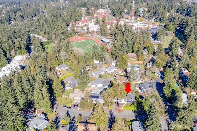 bird's eye view with a forest view and a residential view