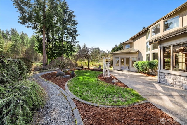 view of yard with french doors