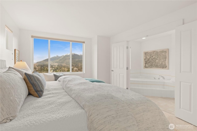 bedroom featuring a mountain view