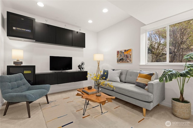 living room featuring baseboards and recessed lighting