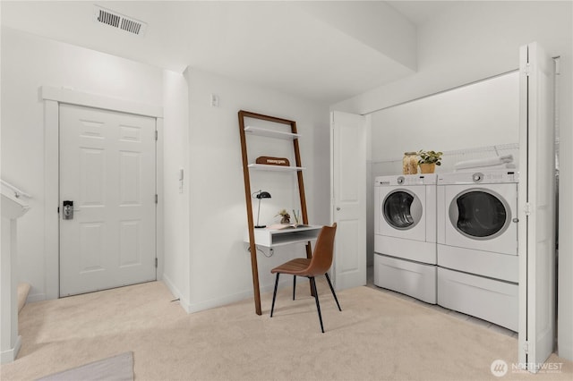 laundry area with visible vents, light carpet, laundry area, independent washer and dryer, and baseboards