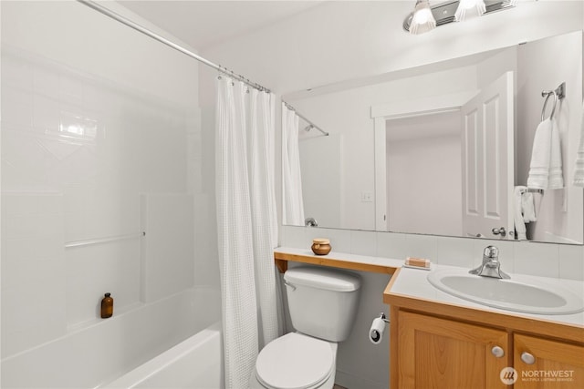 full bath featuring toilet, shower / bathtub combination with curtain, backsplash, and vanity