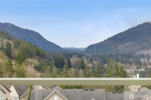 view of mountain feature featuring a forest view